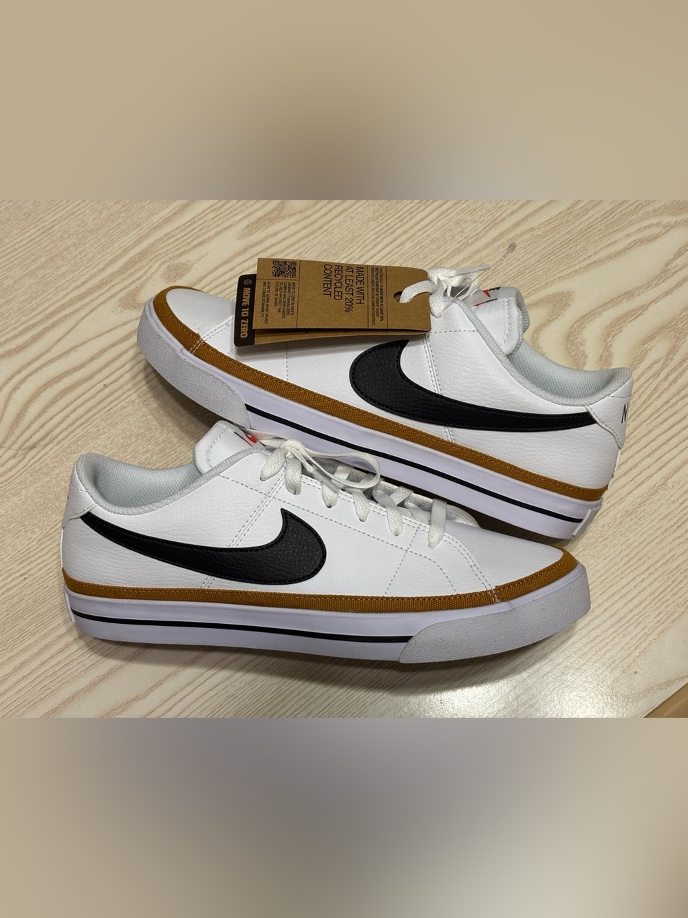 Nike White Leather Sneakers with Black Swoosh and Tan Accent